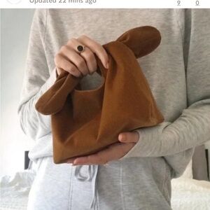 New MERIT Signature Clutch Bag Ties At The Top